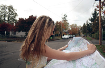 Girl Searching the Place in The Map